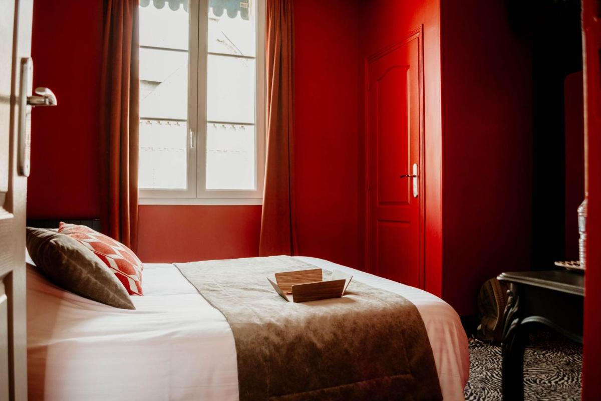 Un ou plusieurs lits dans un hébergement de l'établissement La villa 10 HÔTEL SPA