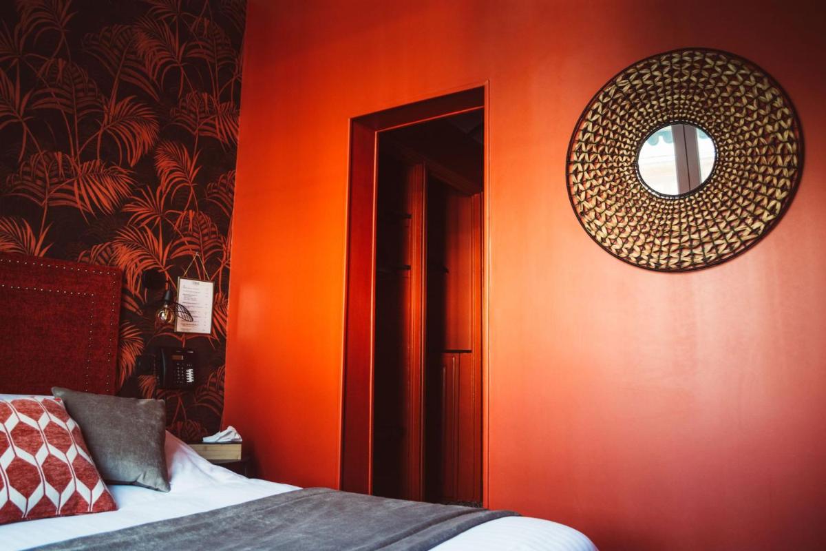 Un ou plusieurs lits dans un hébergement de l'établissement La villa 10 HÔTEL SPA