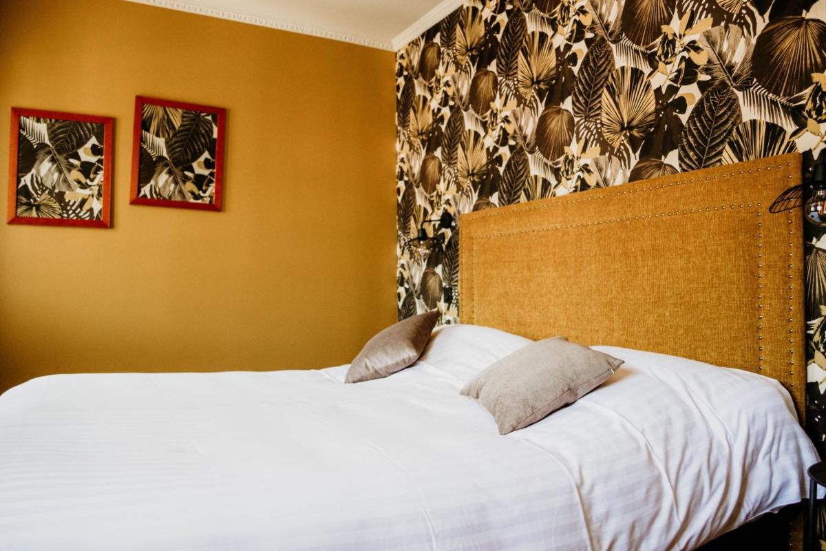 Un ou plusieurs lits dans un hébergement de l'établissement La villa 10 HÔTEL SPA