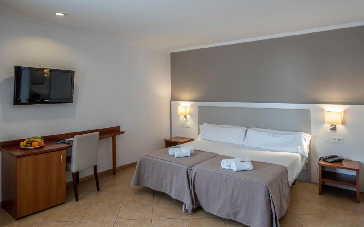 Cama o camas de una habitación en Rosamar & Spa 4*s