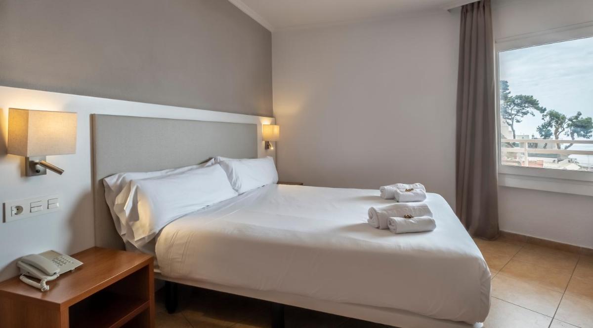 Cama o camas de una habitación en Rosamar & Spa 4*s