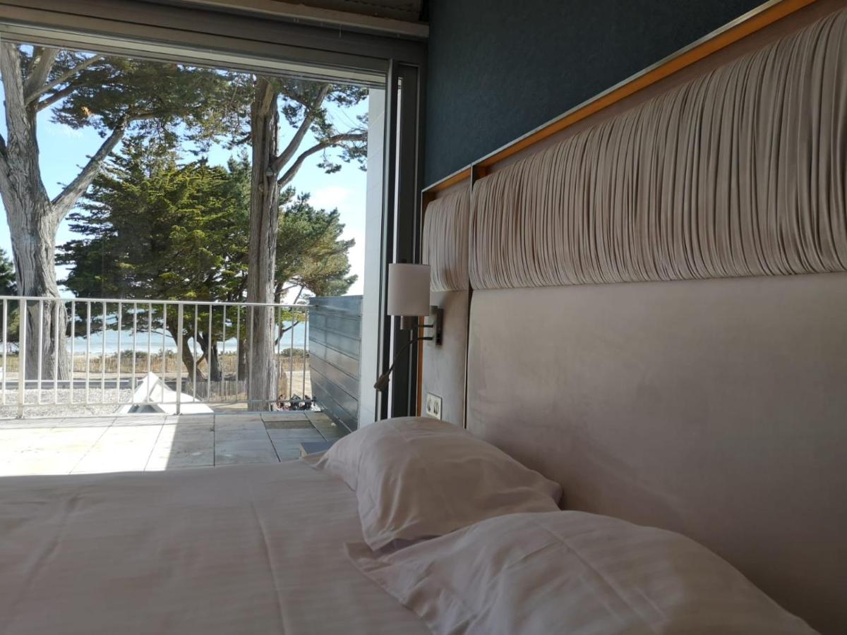 Un ou plusieurs lits dans un hébergement de l'établissement Le Diana Hôtel & Spa