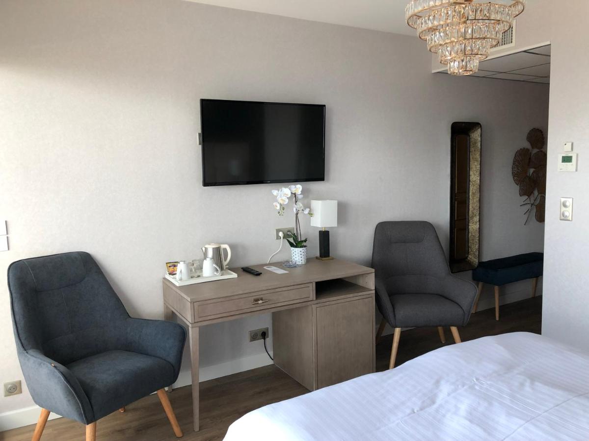 Un ou plusieurs lits dans un hébergement de l'établissement Le Diana Hôtel & Spa
