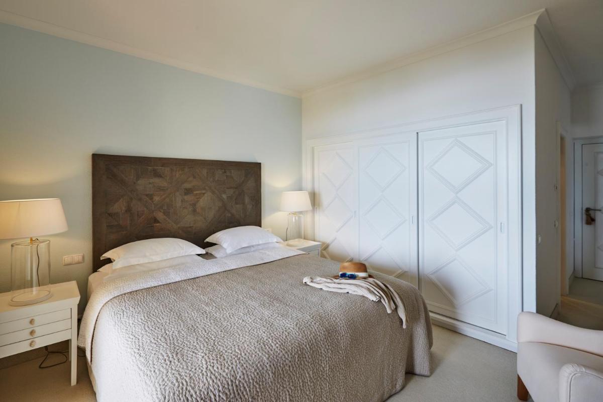 Uma cama ou camas num quarto em Vila Joya