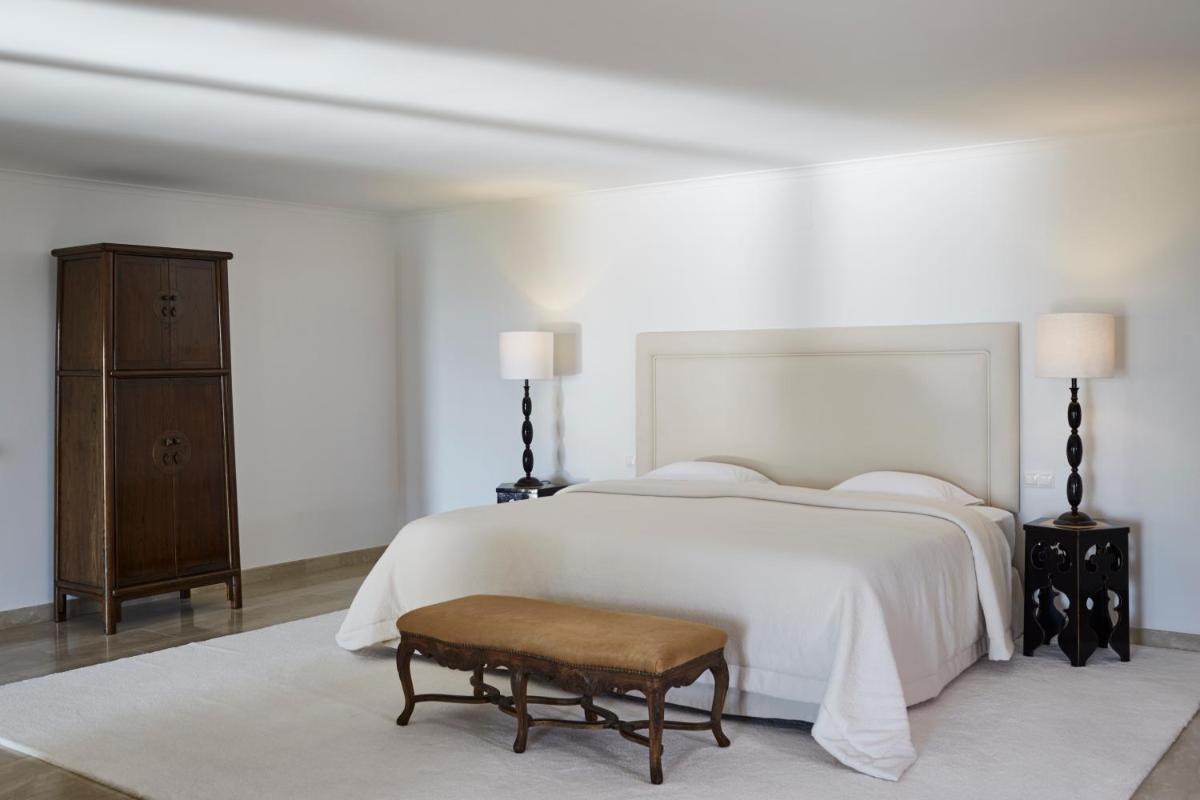 Uma cama ou camas num quarto em Vila Joya