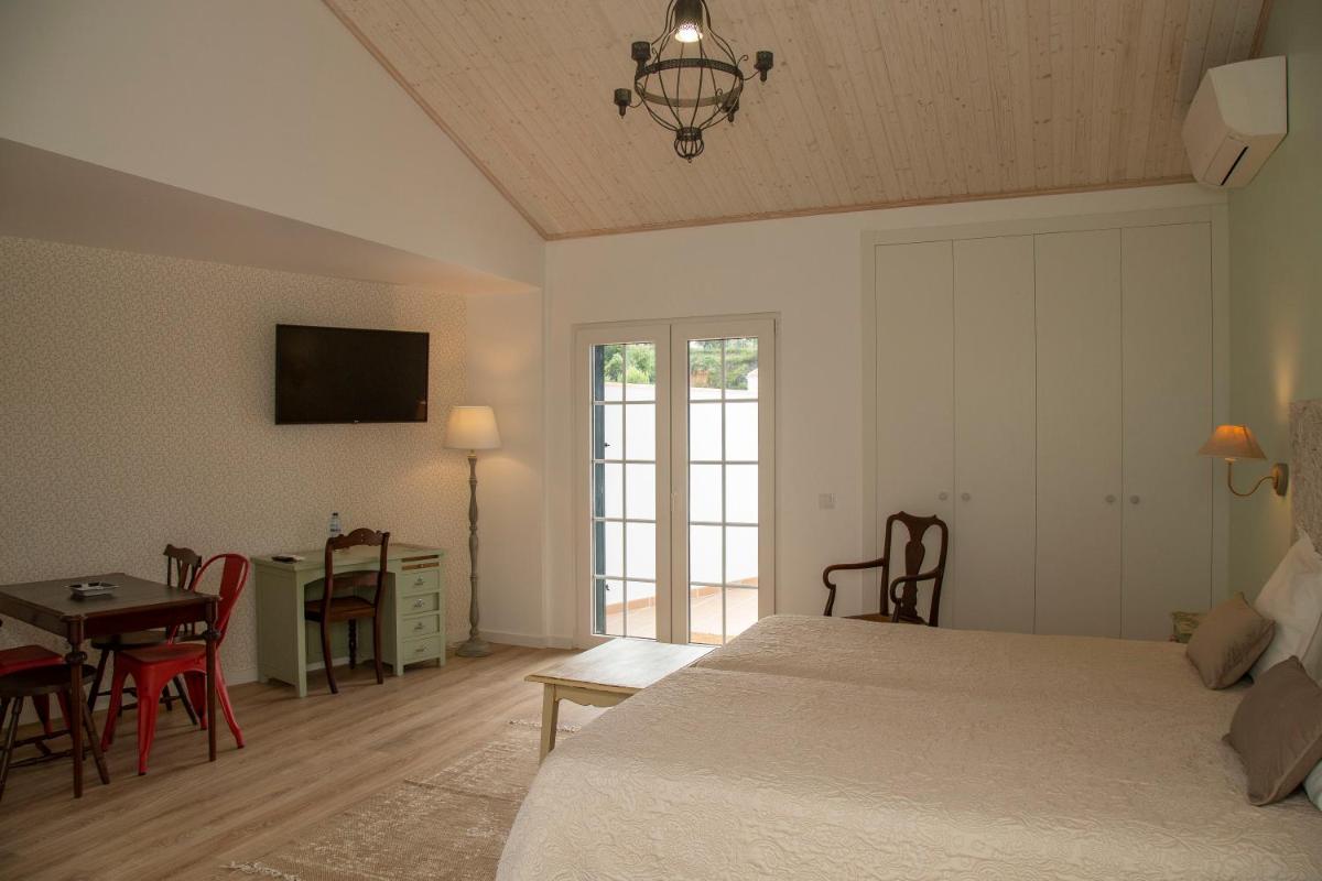 Uma cama ou camas num quarto em Aires da Serra Hotel