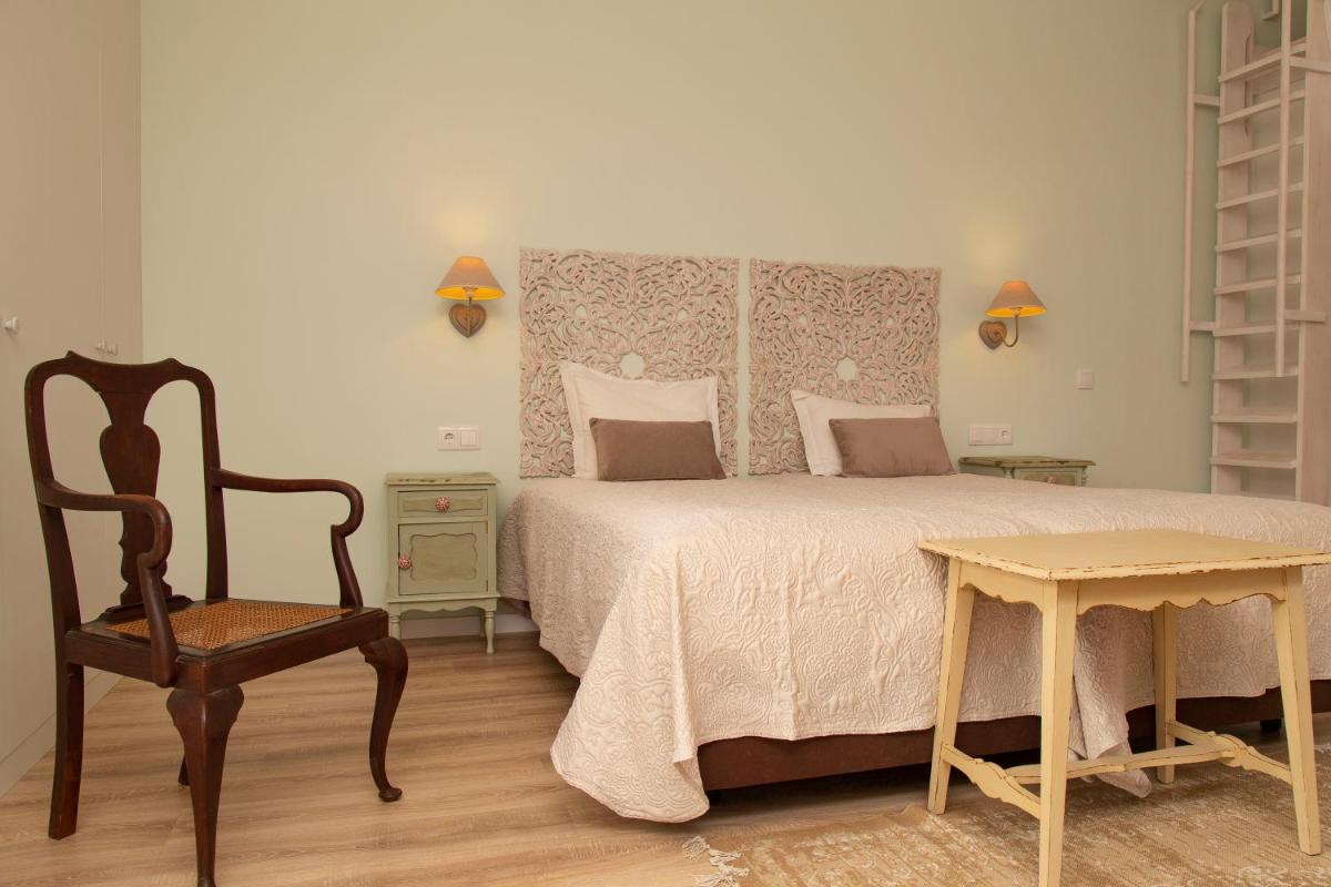 Uma cama ou camas num quarto em Aires da Serra Hotel