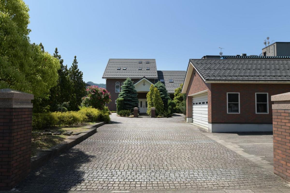 Guesthouse Kizuna - Housity