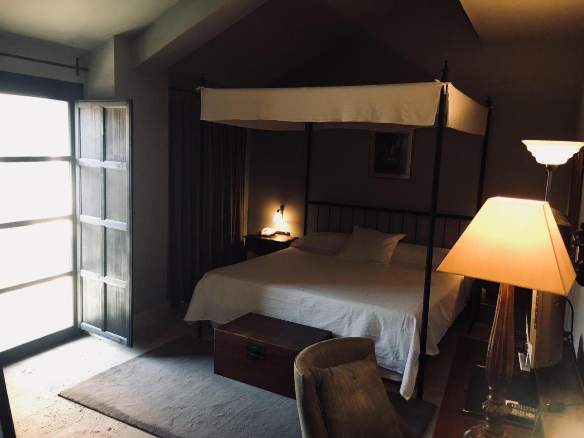Cama o camas de una habitación en Hotel Palacio de Mengibar