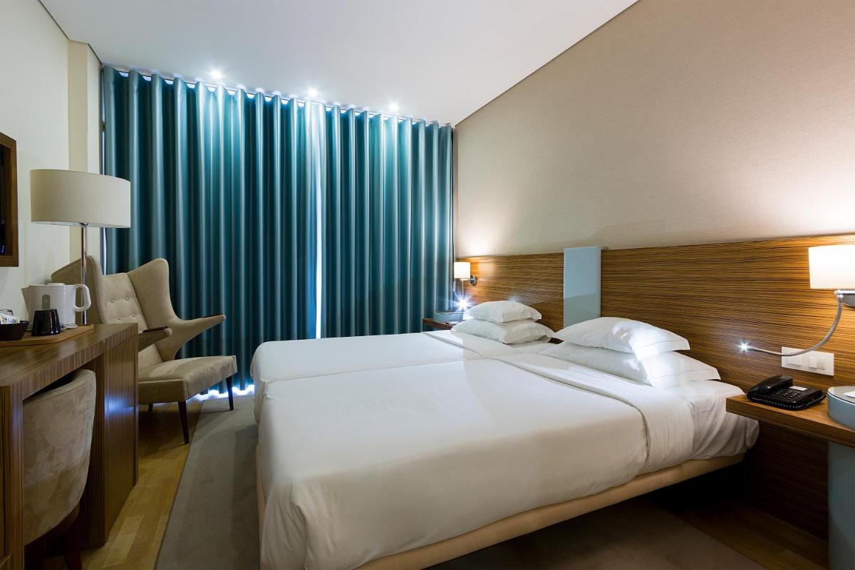 Uma cama ou camas num quarto em Hotel Meira
