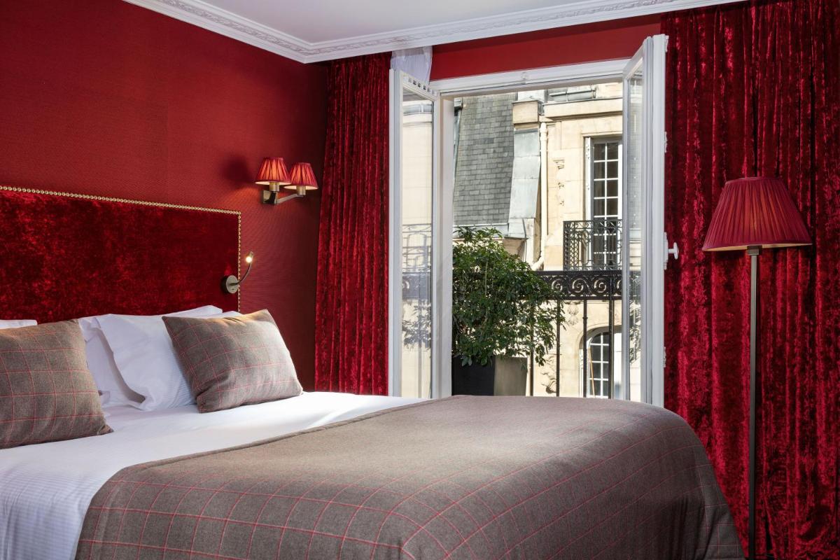 Un ou plusieurs lits dans un hébergement de l'établissement Hotel Monsieur & Spa