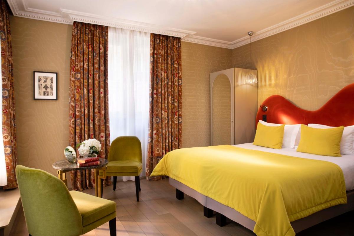 Un ou plusieurs lits dans un hébergement de l'établissement Hotel Monsieur & Spa