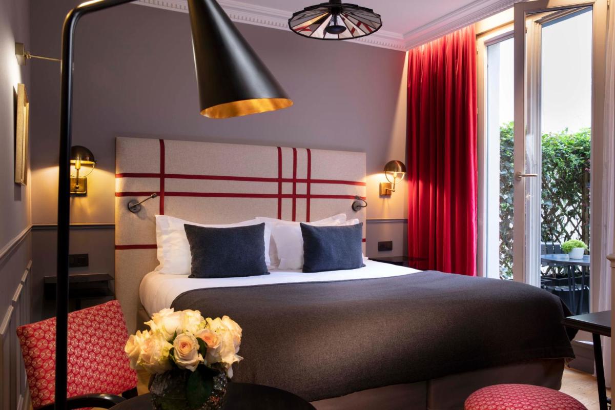 Un ou plusieurs lits dans un hébergement de l'établissement Hotel Monsieur & Spa