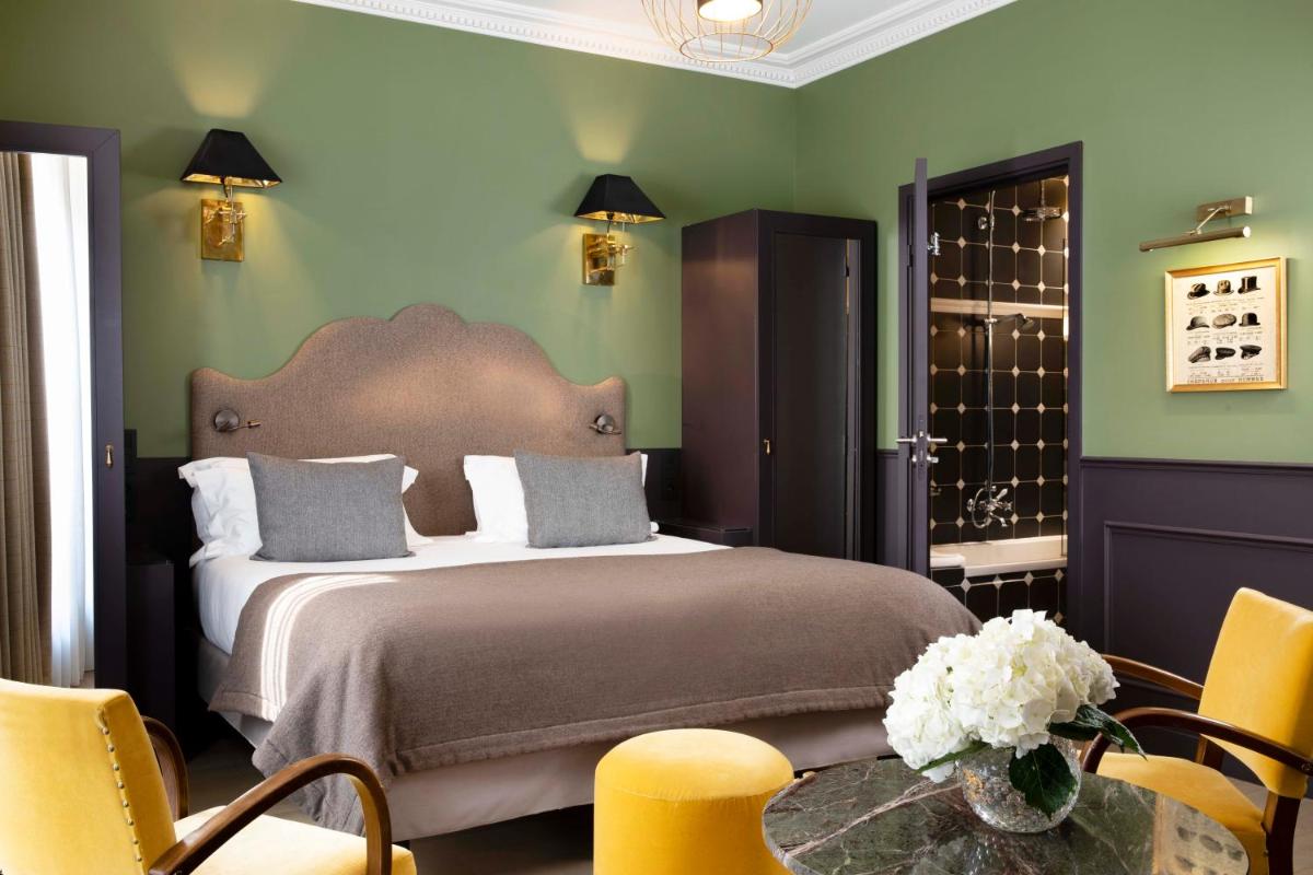 Un ou plusieurs lits dans un hébergement de l'établissement Hotel Monsieur & Spa