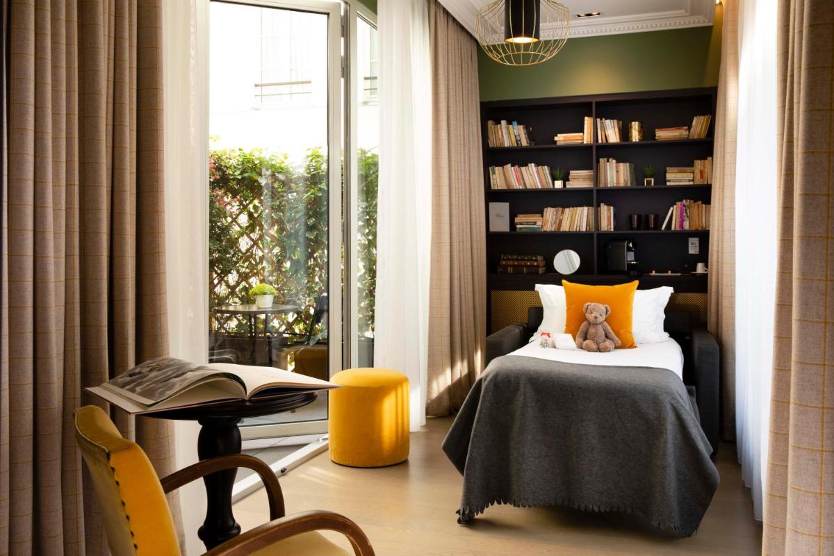 Un ou plusieurs lits dans un hébergement de l'établissement Hotel Monsieur & Spa