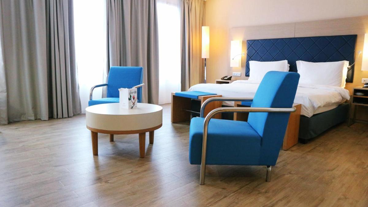 Un ou plusieurs lits dans un hébergement de l'établissement Radisson Blu Hotel Toulouse Airport