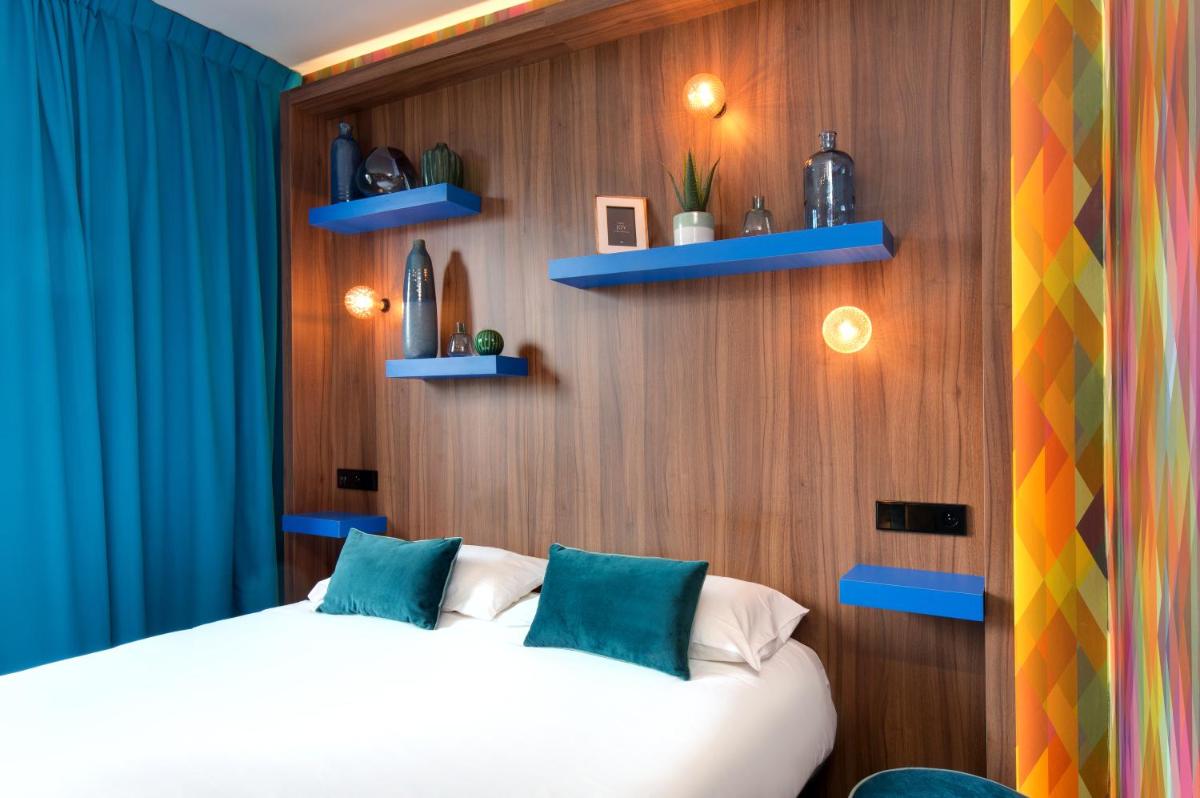 Un ou plusieurs lits dans un hébergement de l'établissement Hôtel Montmorency & Spa