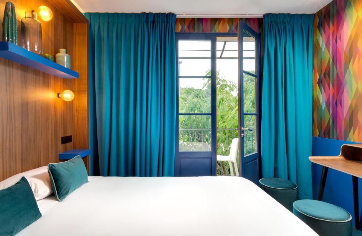 Un ou plusieurs lits dans un hébergement de l'établissement Hôtel Montmorency & Spa