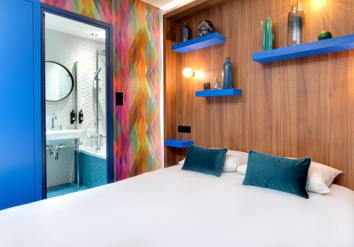 Un ou plusieurs lits dans un hébergement de l'établissement Hôtel Montmorency & Spa
