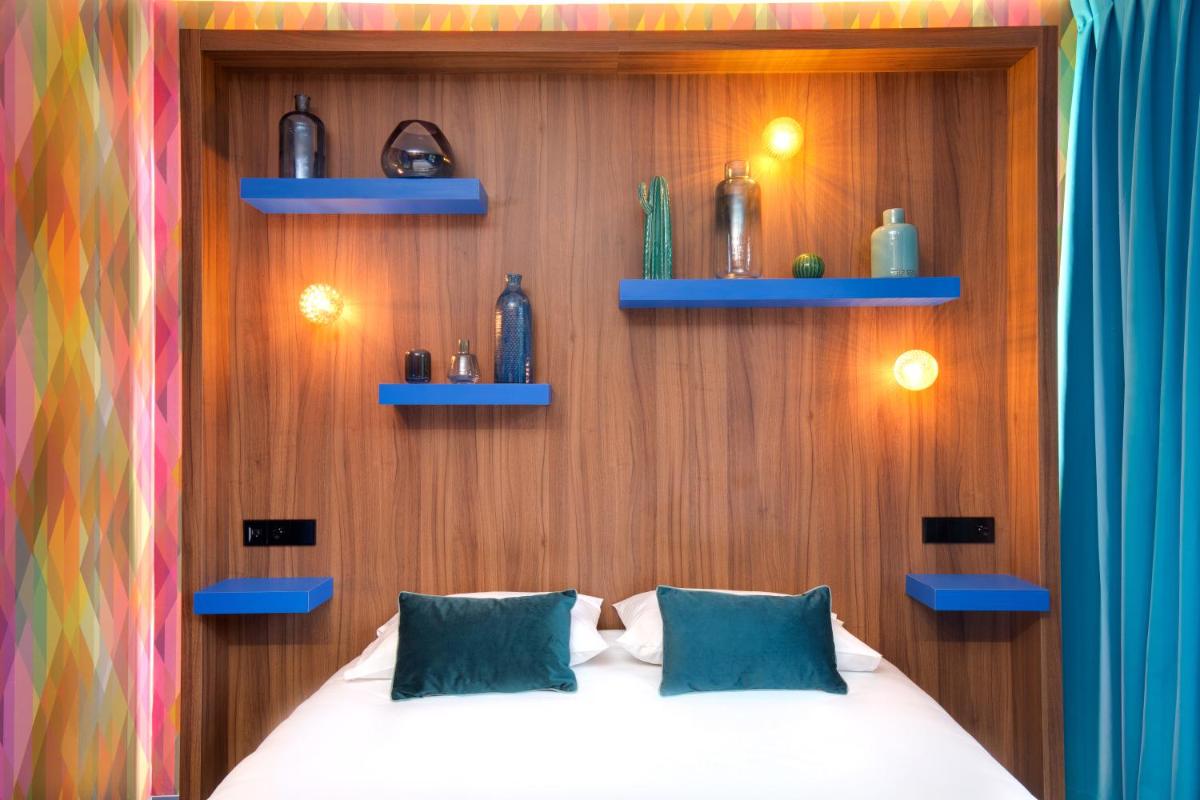 Un ou plusieurs lits dans un hébergement de l'établissement Hôtel Montmorency & Spa