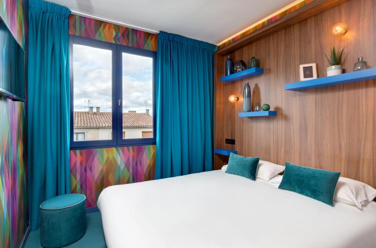 Un ou plusieurs lits dans un hébergement de l'établissement Hôtel Montmorency & Spa