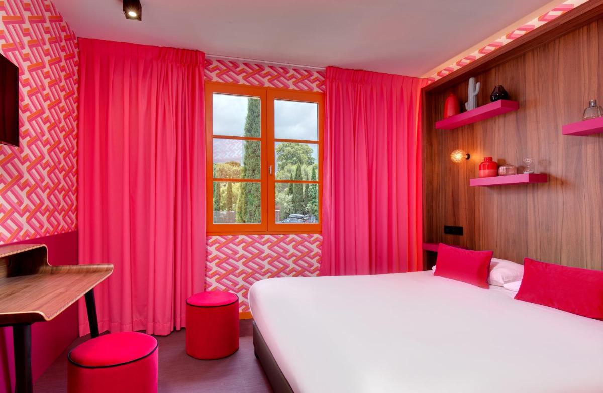 Un ou plusieurs lits dans un hébergement de l'établissement Hôtel Montmorency & Spa