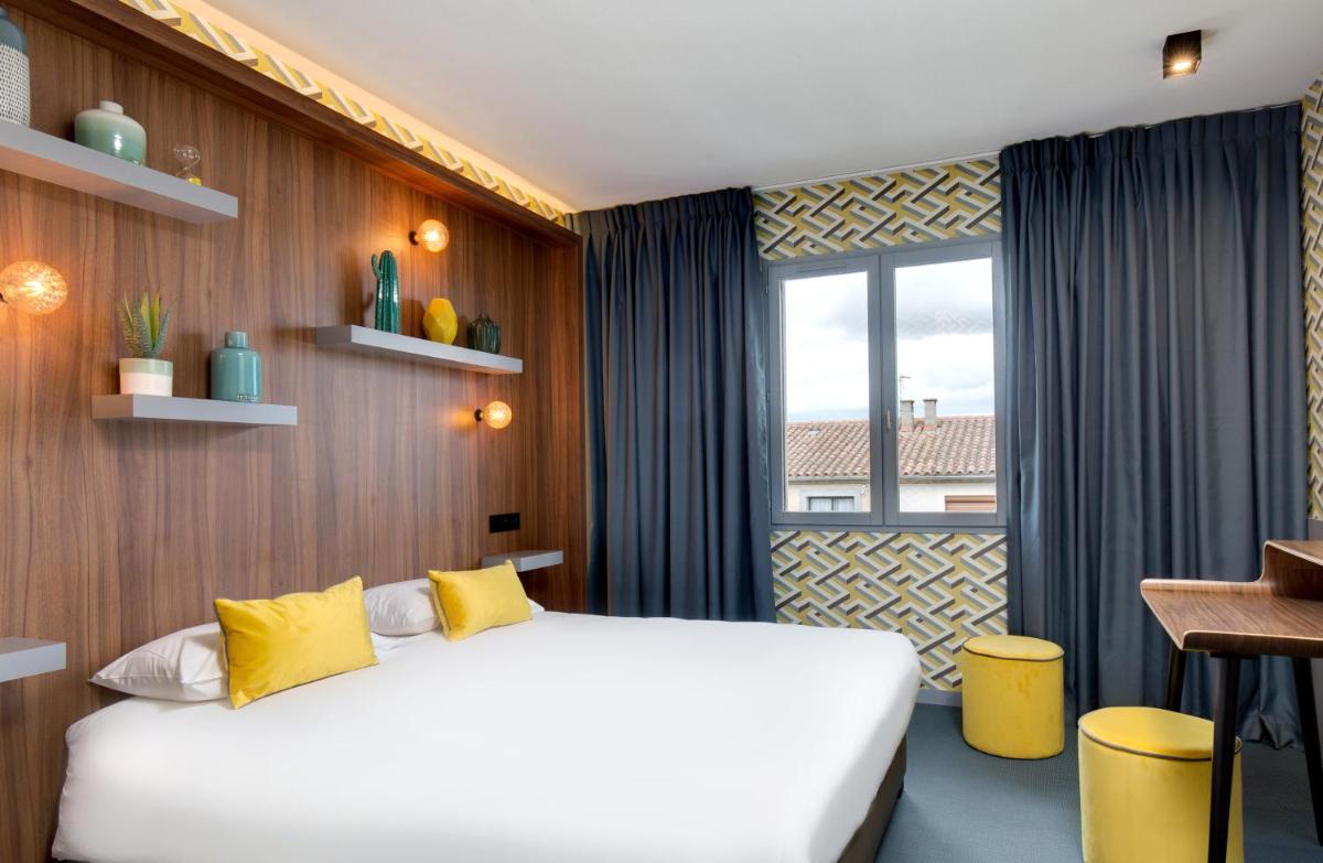 Un ou plusieurs lits dans un hébergement de l'établissement Hôtel Montmorency & Spa