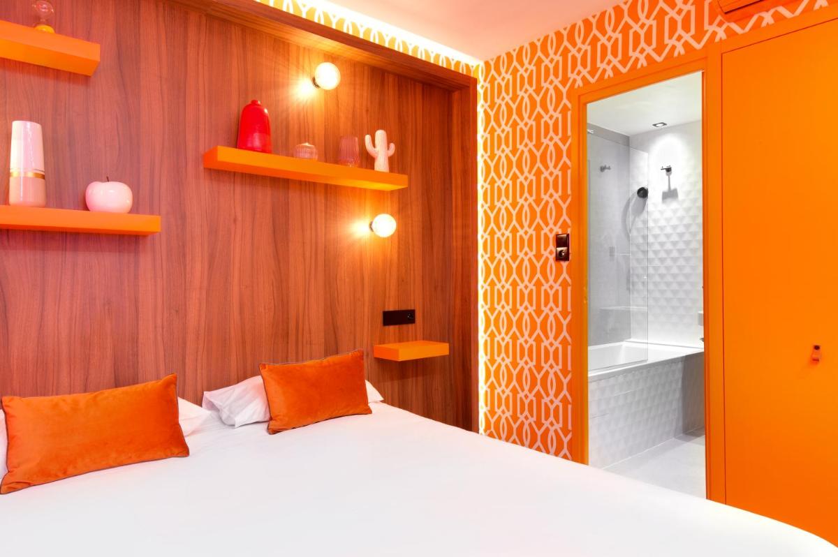 Un ou plusieurs lits dans un hébergement de l'établissement Hôtel Montmorency & Spa