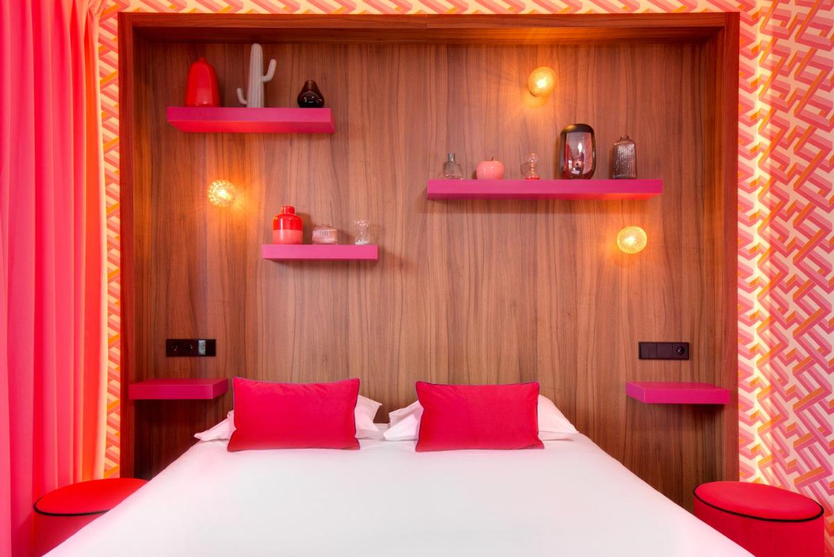 Un ou plusieurs lits dans un hébergement de l'établissement Hôtel Montmorency & Spa