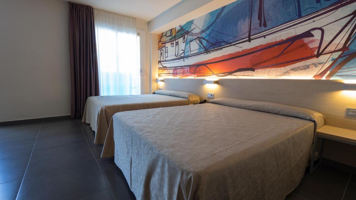Cama o camas de una habitación en Hotel Riviera