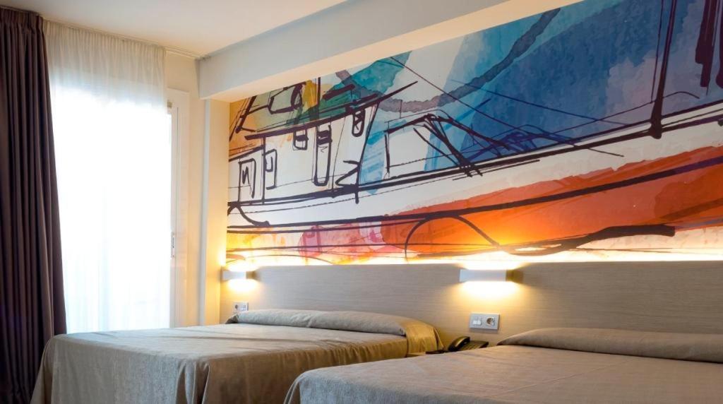 Cama o camas de una habitación en Hotel Riviera