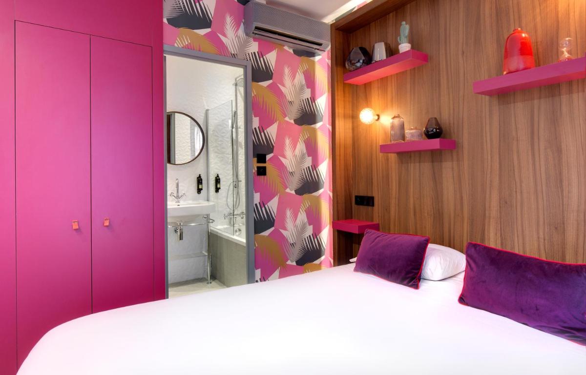 Un ou plusieurs lits dans un hébergement de l'établissement Hôtel Montmorency & Spa