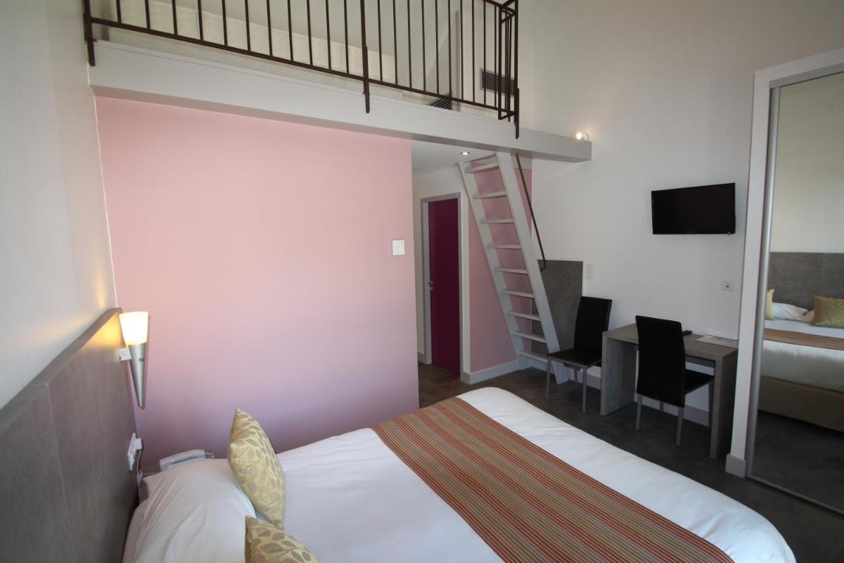 Un ou plusieurs lits dans un hébergement de l'établissement Logis Hotel Archambeau