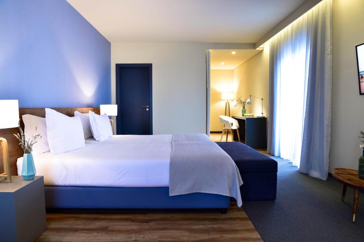 Uma cama ou camas num quarto em The Prime Energize Hotel & SPA - Algarve