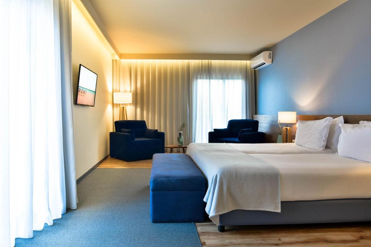 Uma cama ou camas num quarto em The Prime Energize Hotel & SPA - Algarve