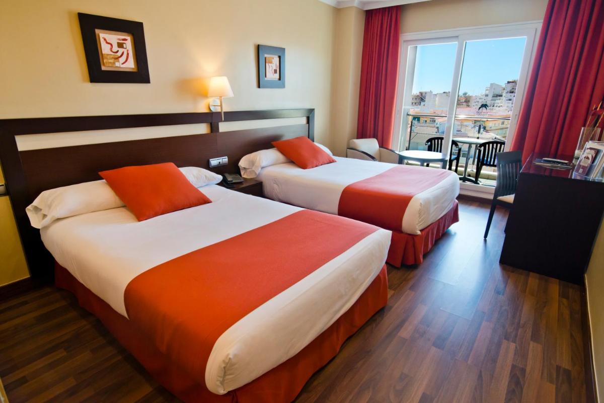 Cama o camas de una habitación en Bahía Almuñecar
