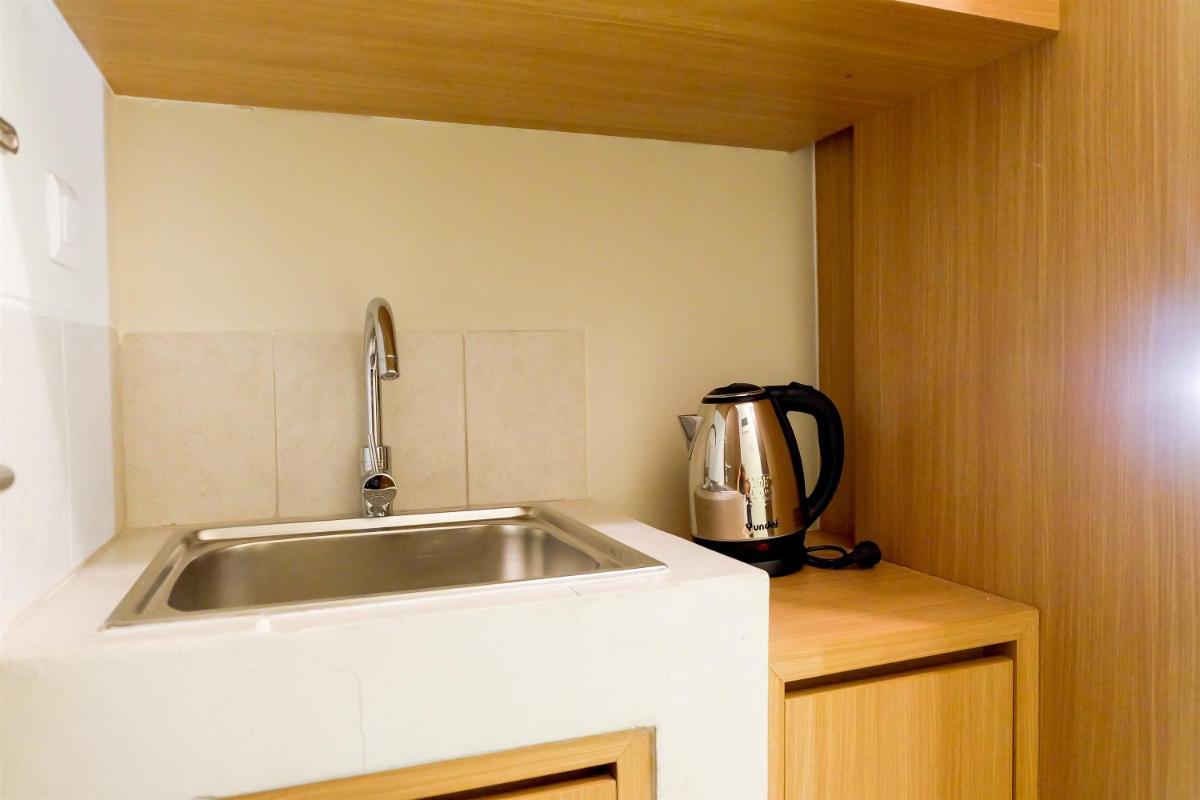 Comfy Studio Mustika Golf Apartment By Travelio - Housity