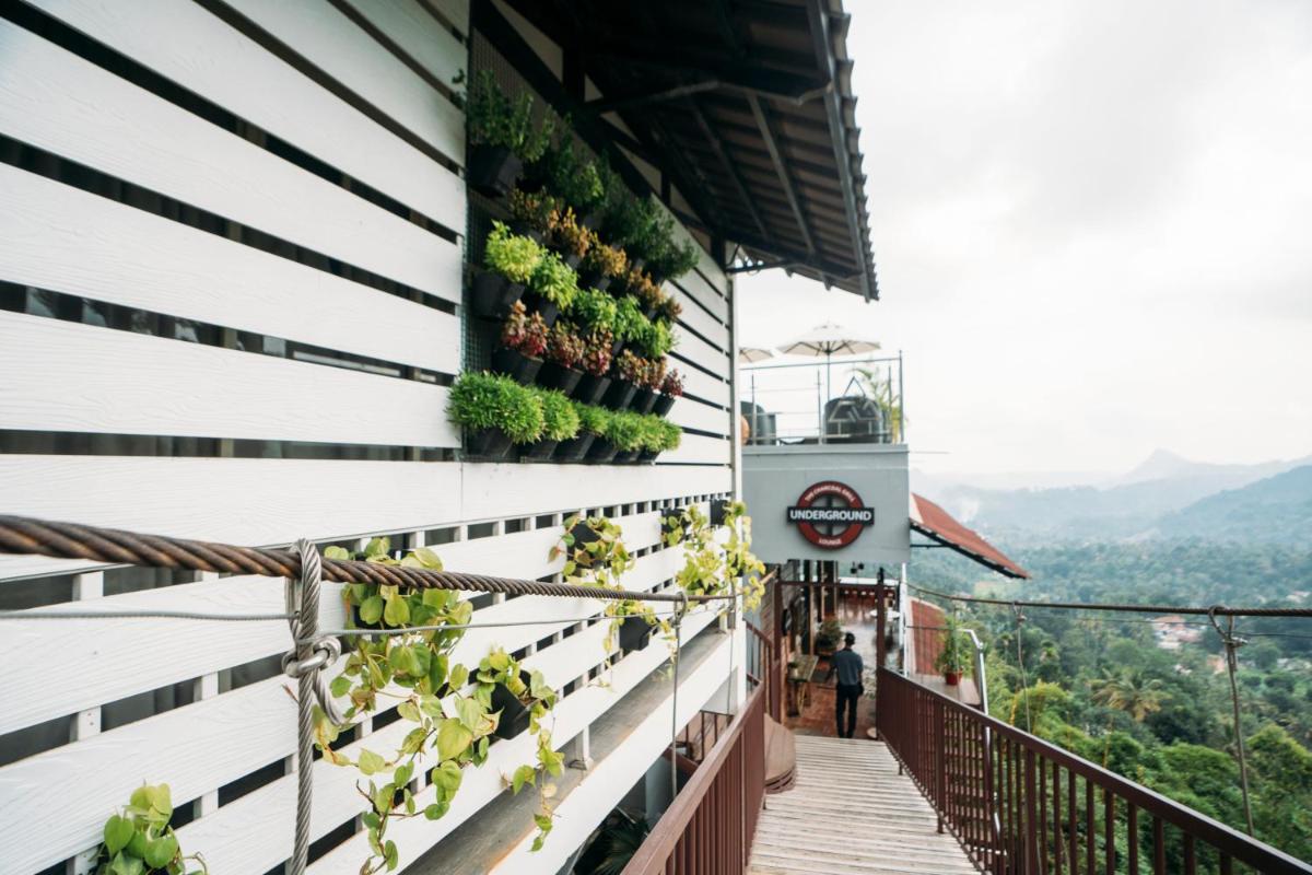 a balcony with plants on the side of a building at The Panoramic Getaway in Munnar