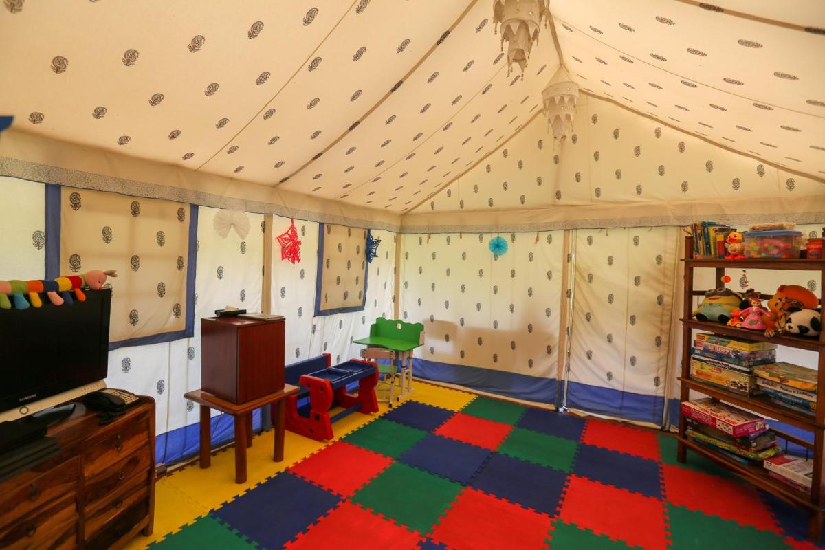 a room with a wall with a climbing wall at Trident Agra in Agra