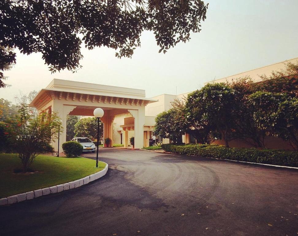 a car is parked in front of a building at Trident Agra in Agra