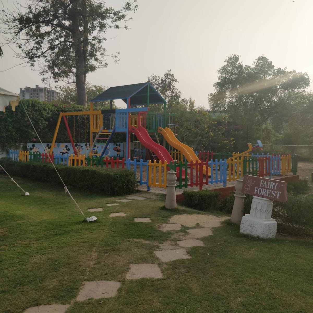 a playground in a park in the rain at Trident Agra in Agra