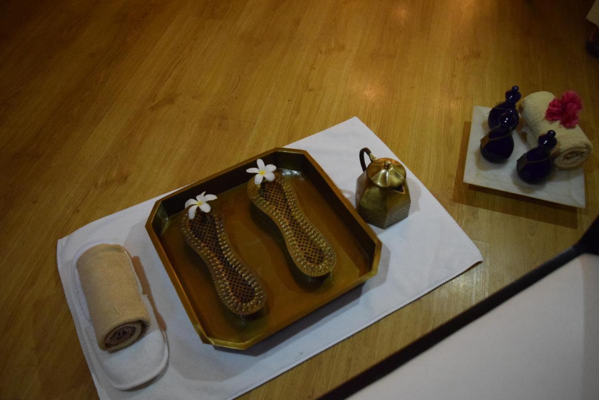 a cake with shoes on a table with other items at Trident Agra in Agra