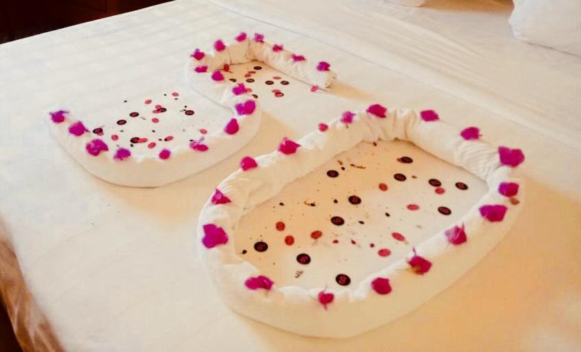 two cakes with hearts on them sitting on a table at Trident Agra in Agra