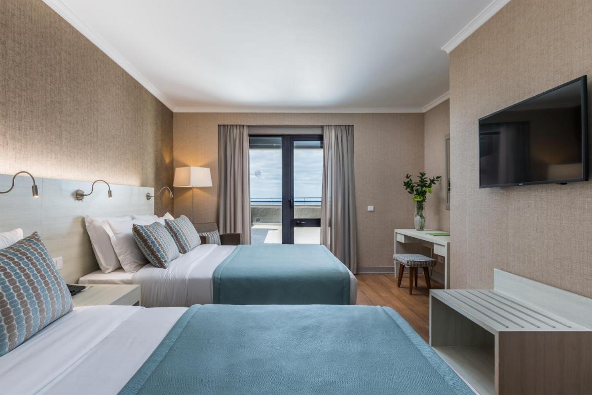 Uma cama ou camas num quarto em Enotel Lido - All Inclusive