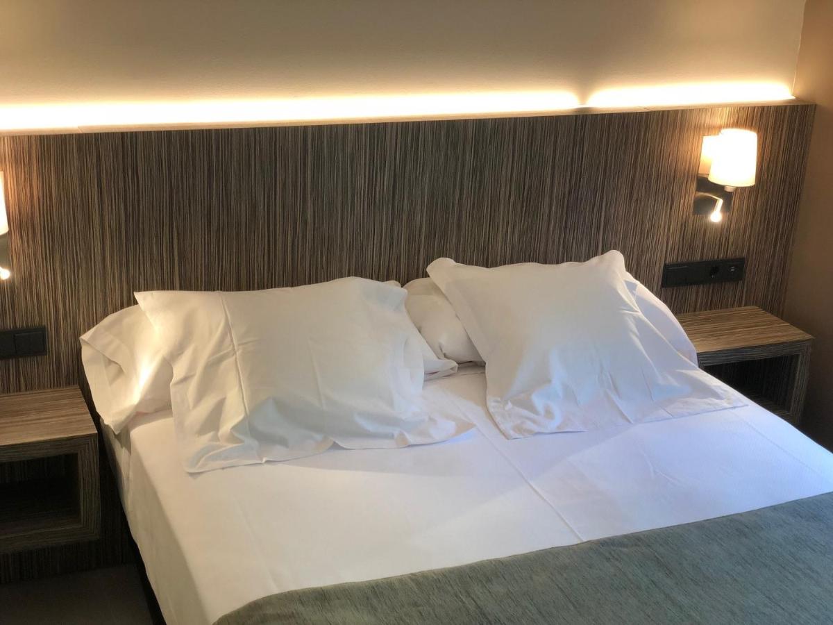 Cama o camas de una habitación en Hotel Balneario de La Virgen