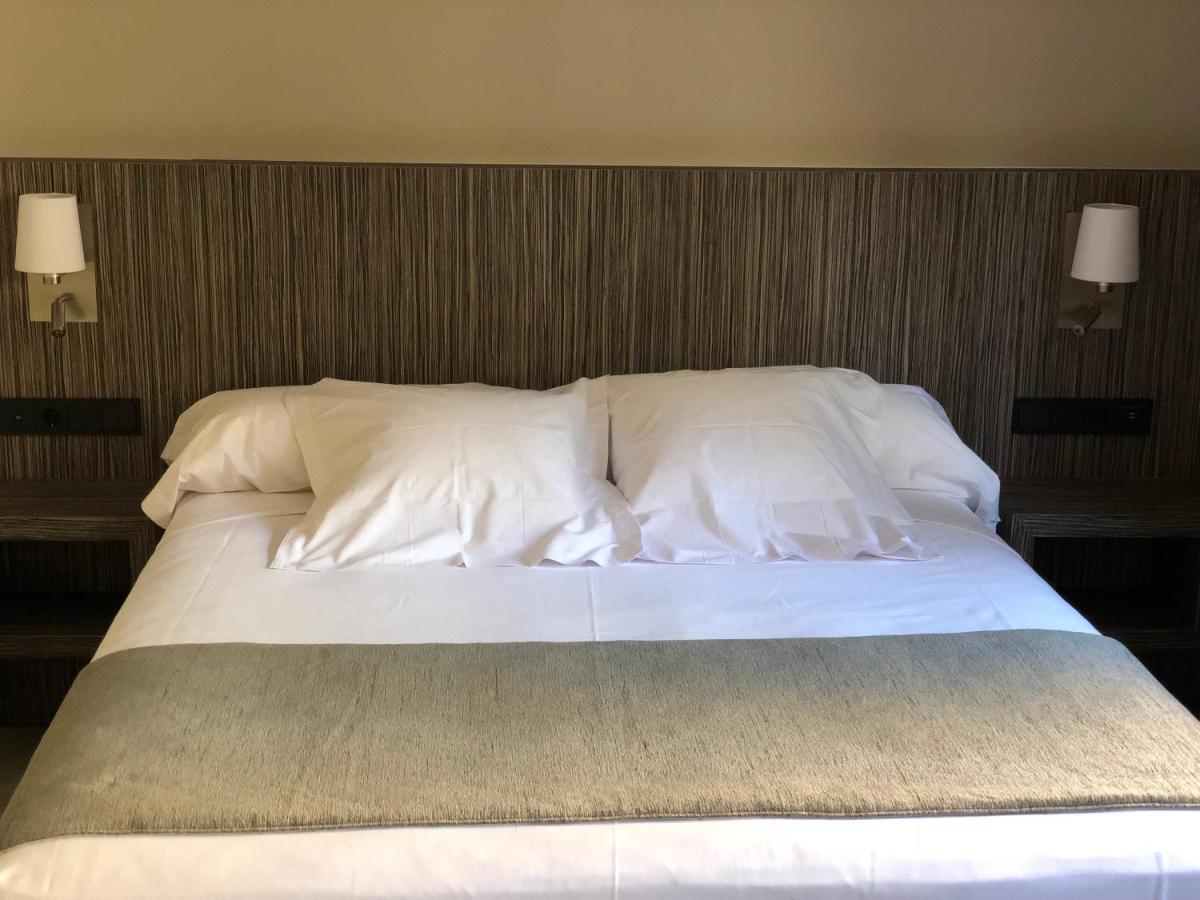 Cama o camas de una habitación en Hotel Balneario de La Virgen