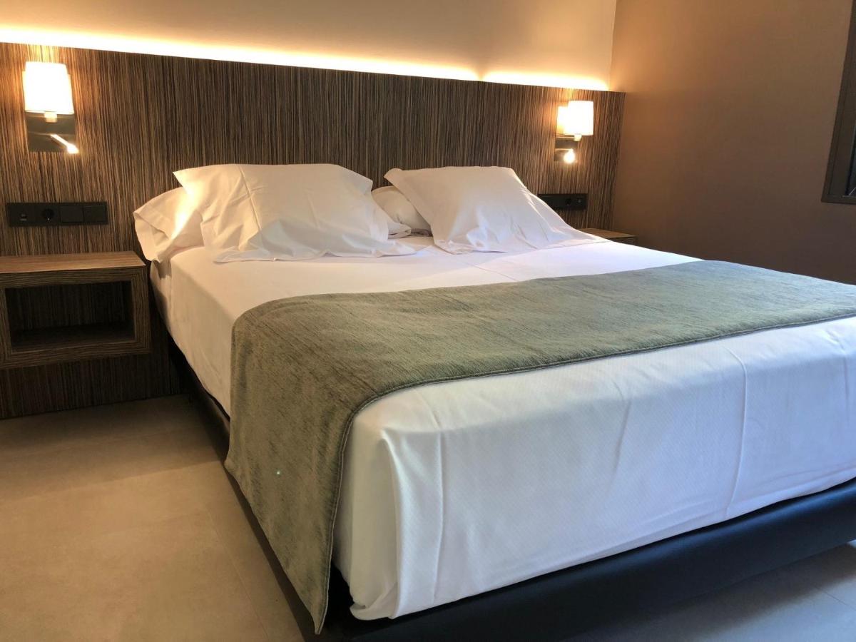 Cama o camas de una habitación en Hotel Balneario de La Virgen