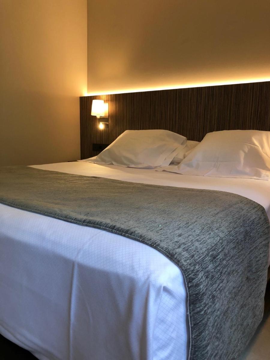 Cama o camas de una habitación en Hotel Balneario de La Virgen
