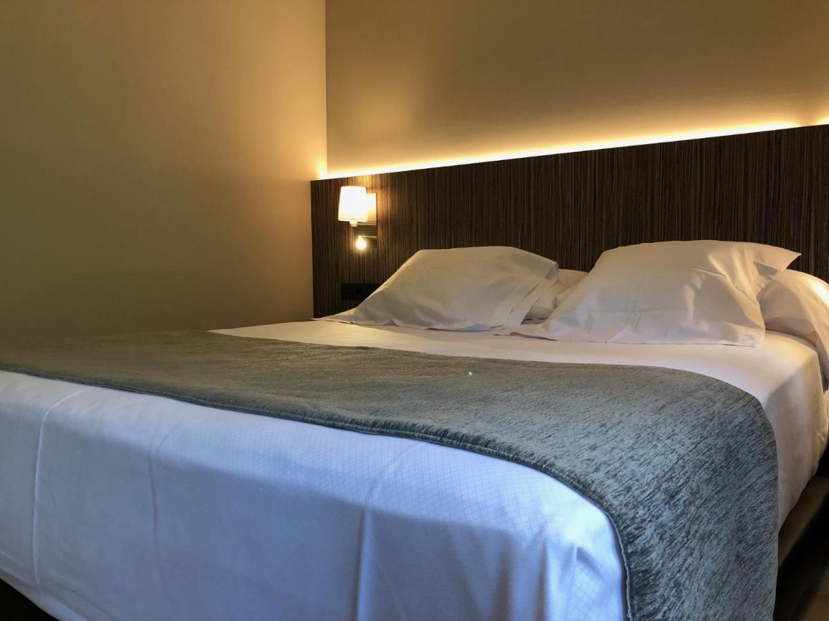 Cama o camas de una habitación en Hotel Balneario de La Virgen