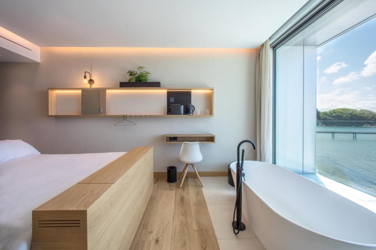 Cama o camas de una habitación en Noa Boutique Hotel